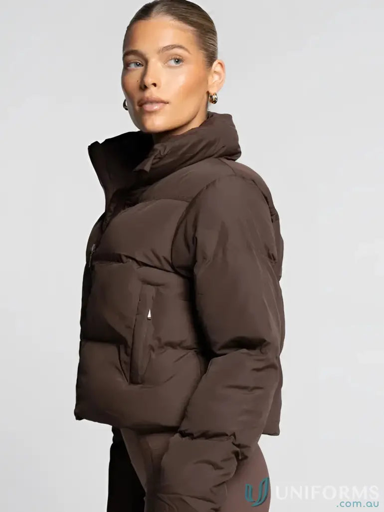 Brown puffer jacket with hood and zipper, likely made of synthetic material for warmth.