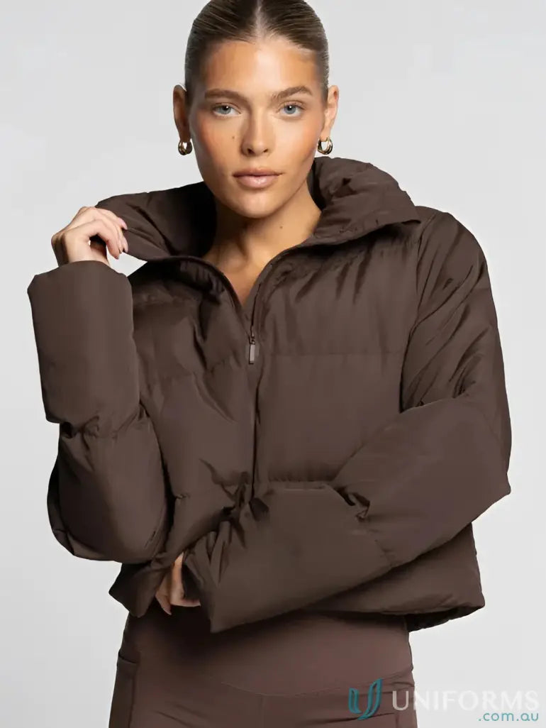 Brown puffer jacket with quilted design and zipper closure.