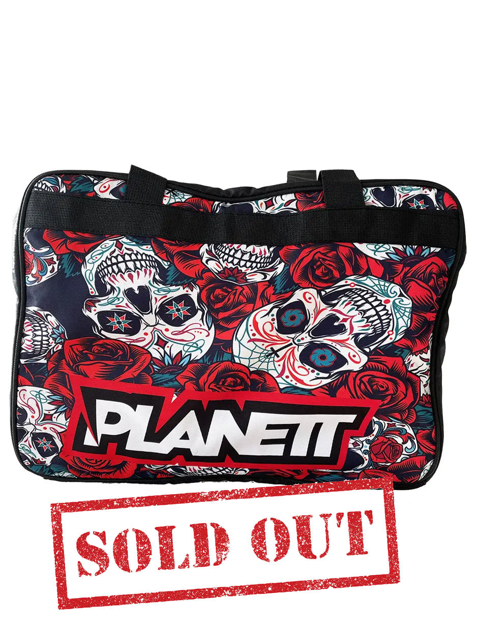 Black duffel bag with a red rose and sugar skull pattern