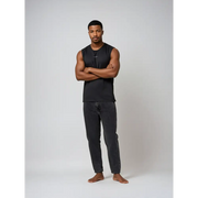 Man in black sleeveless shirt and jeans.