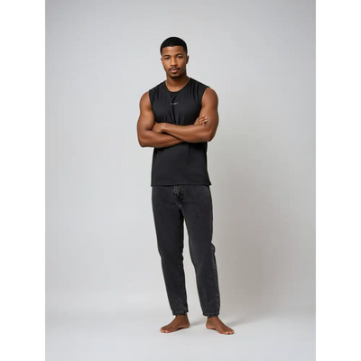 Man in black sleeveless shirt and jeans.