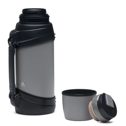 Gray and black thermos with cup.