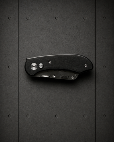 Utility Knife 1509 blank product on dark industrial concrete background