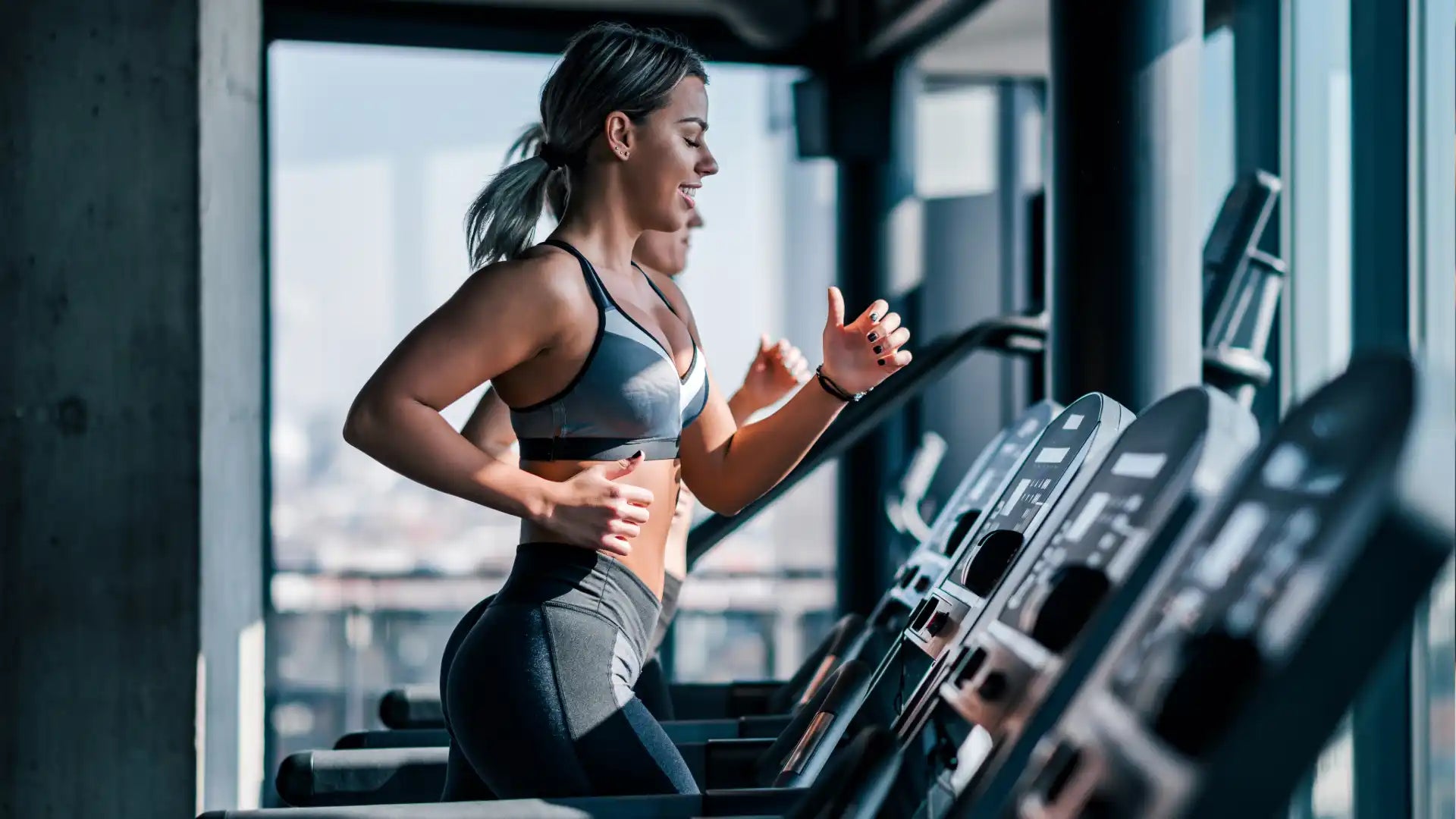 Women running on treadmills.