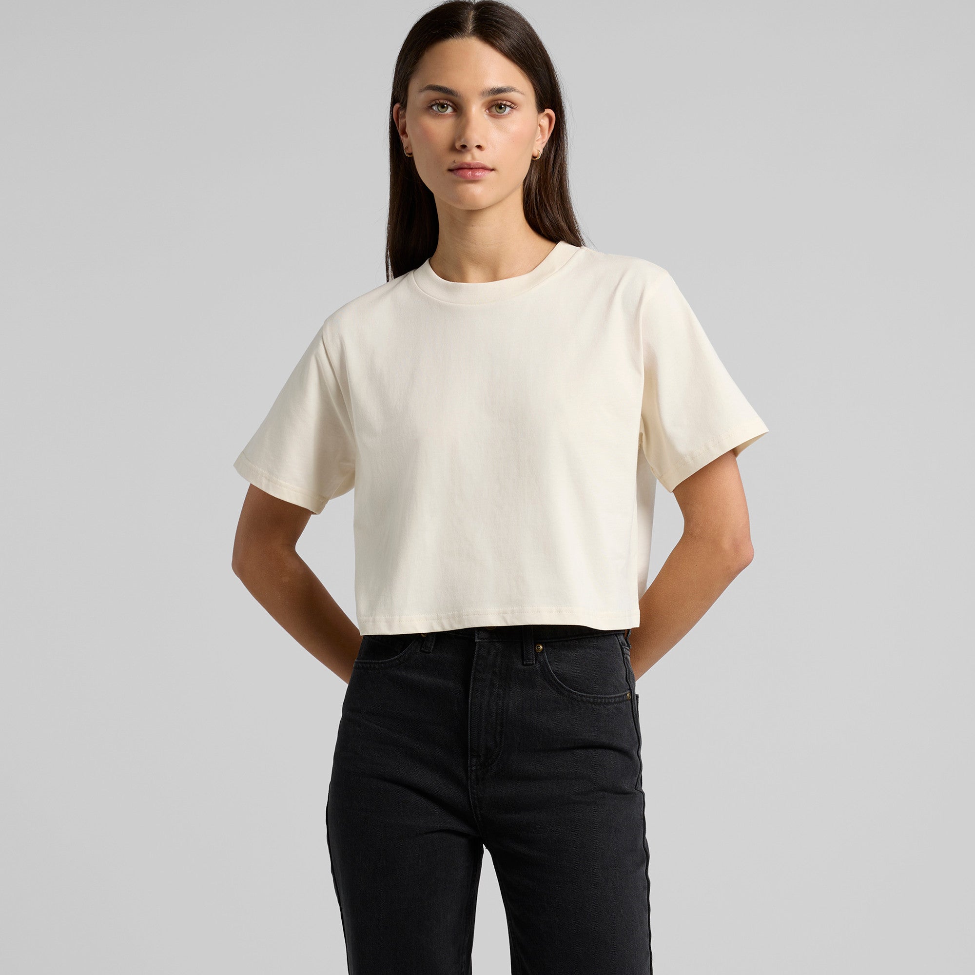 Cream-colored oversized t-shirt with short sleeves and a relaxed fit.