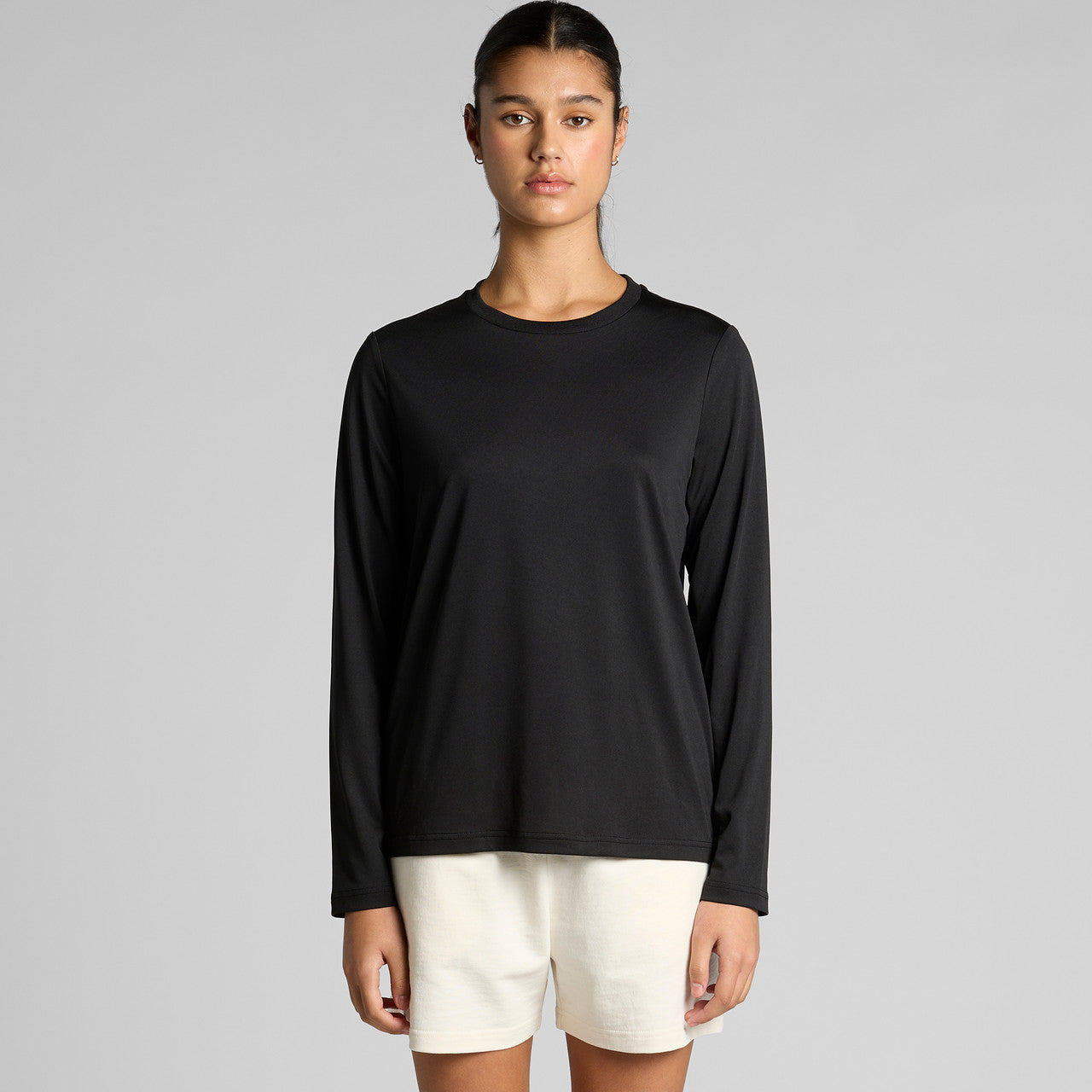 Black long-sleeved t-shirt with white shorts and a minimalist design.