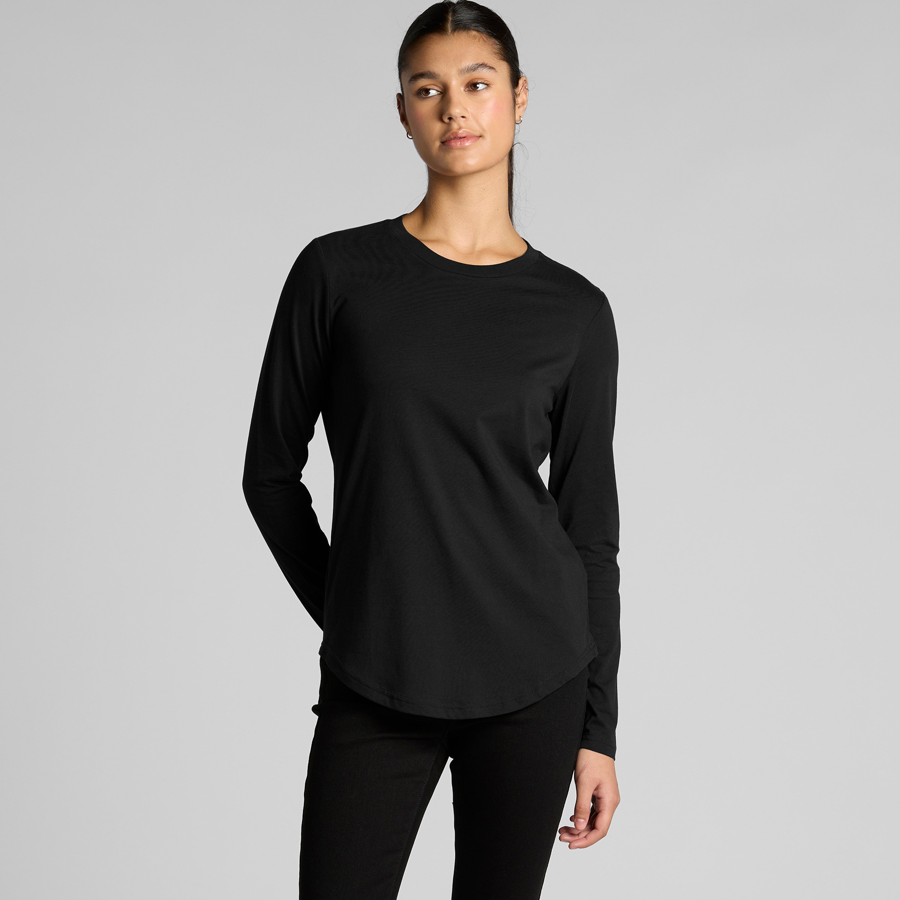 Black long-sleeved athletic top with ribbed cuffs and hem, nike brand.