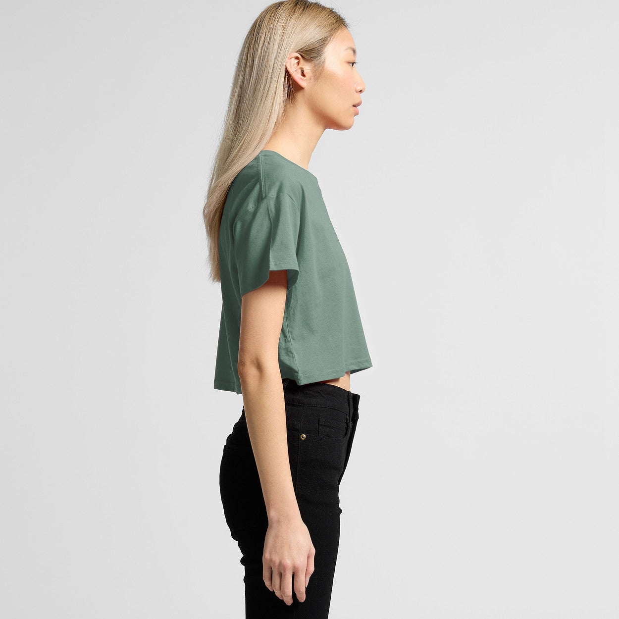 Green cropped t-shirt with black pants