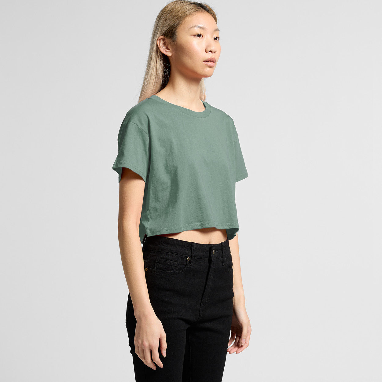 Green cropped t-shirt with black pants
