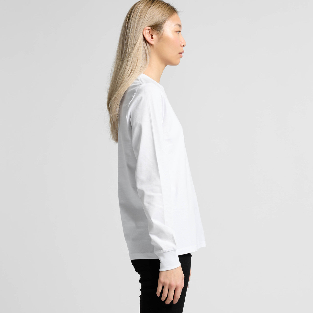 White long-sleeved crew neck t-shirt with ribbed cuffs and hem, likely made of cotton or polyester blend.