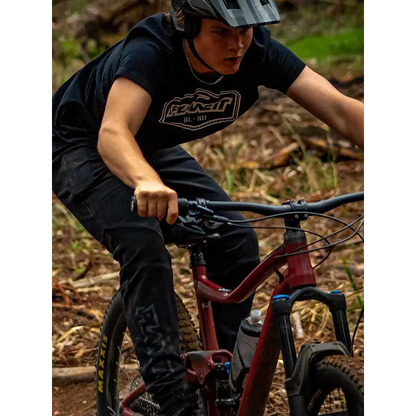 Mountain biker on a red bike.