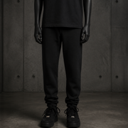 Youth Supply Track Pants 3024 blank product on dark industrial concrete background